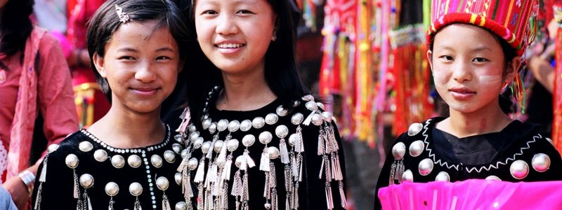 The Deang Minority Group of China three girls in traditional costume