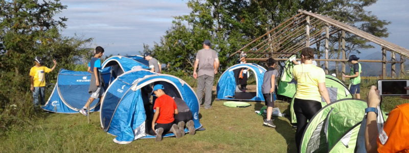 Students setting up camp and tents for an overnight